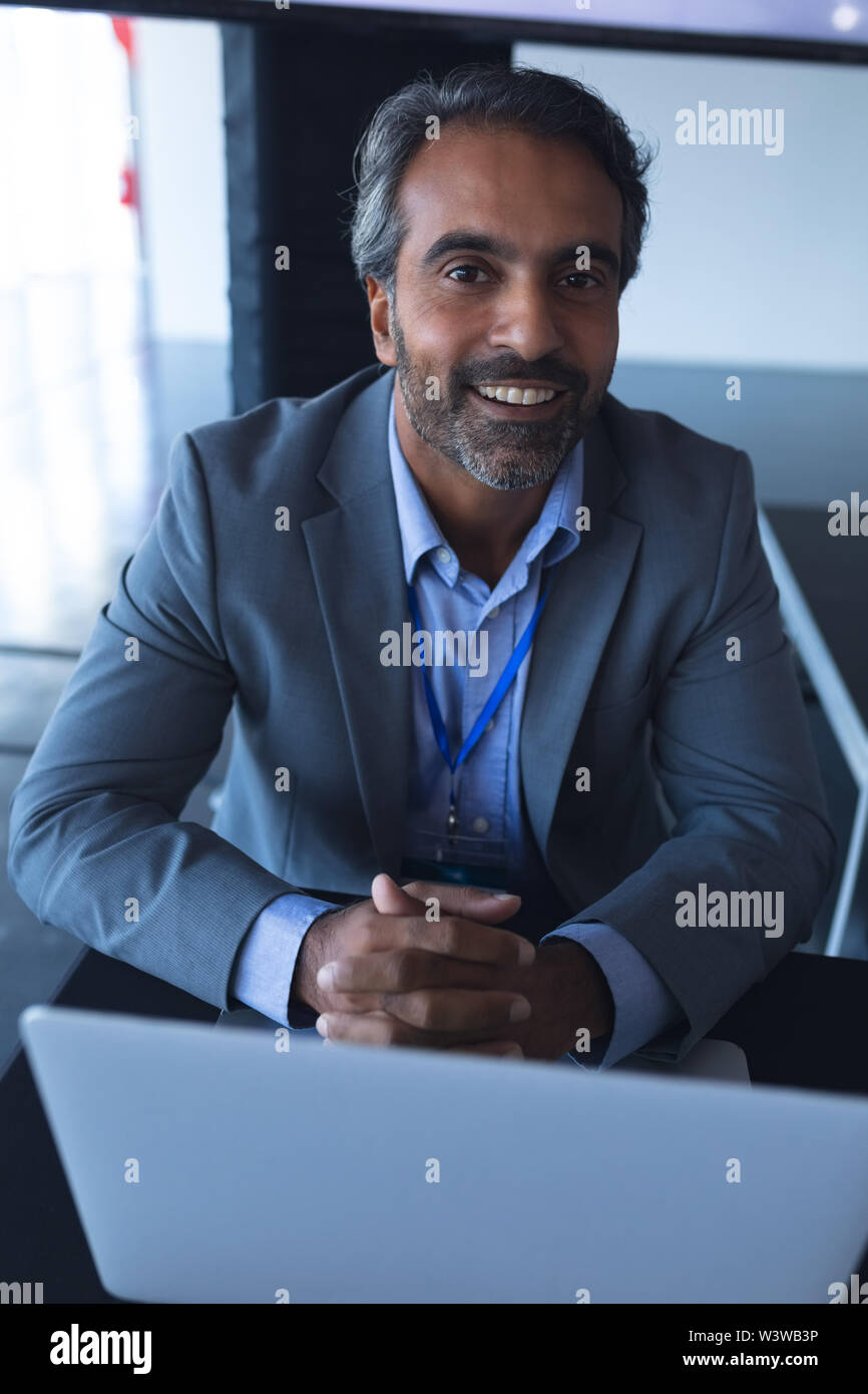 Businessman looking at camera in a business conference Stock Photo