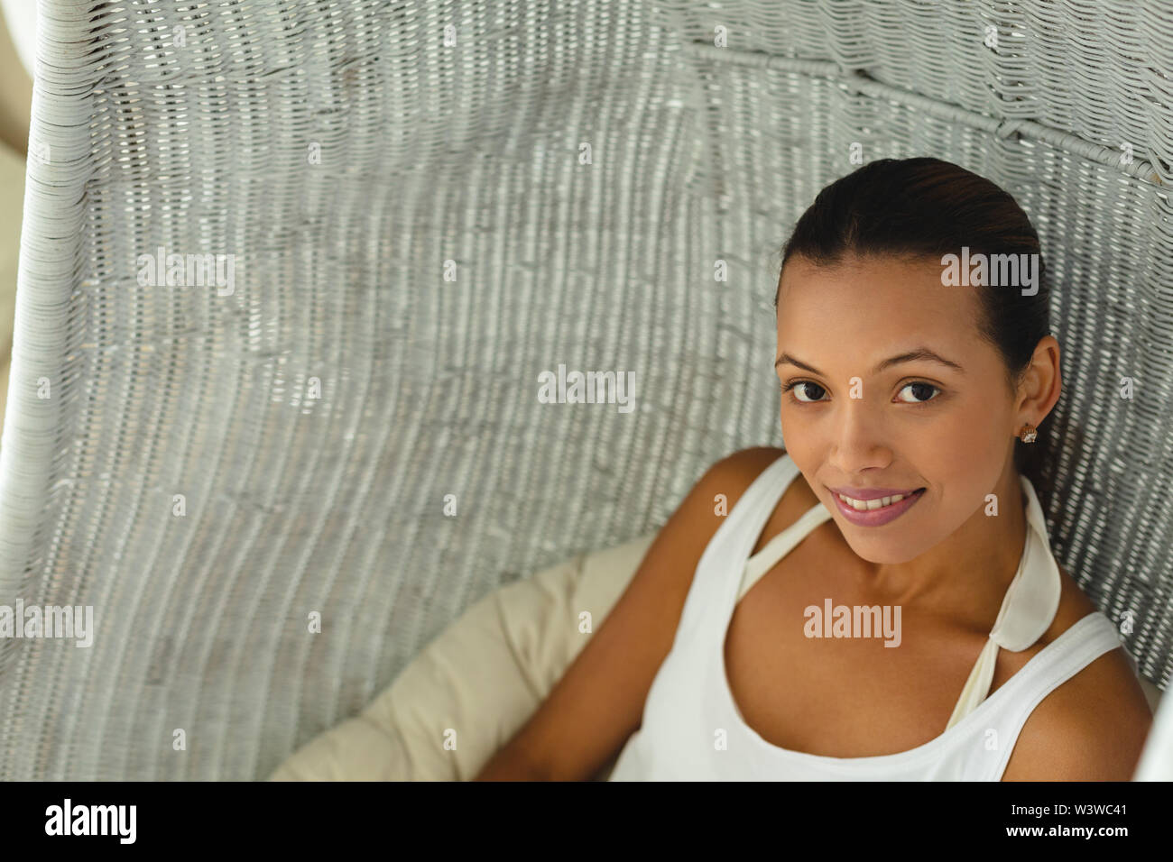 Hanging chair and woman hi-res stock photography and images - Alamy