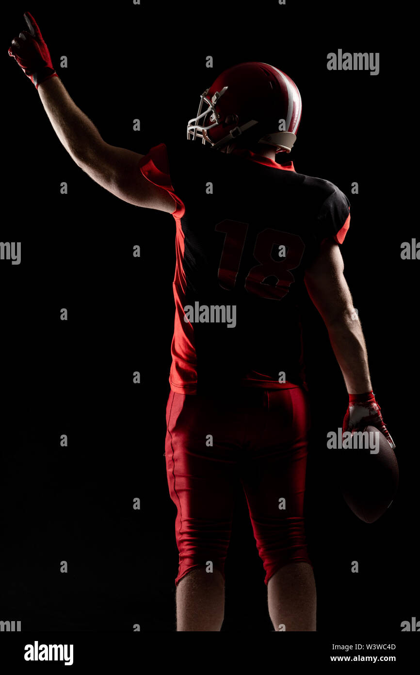 American football player in helmet pointing upwards Stock Photo Alamy