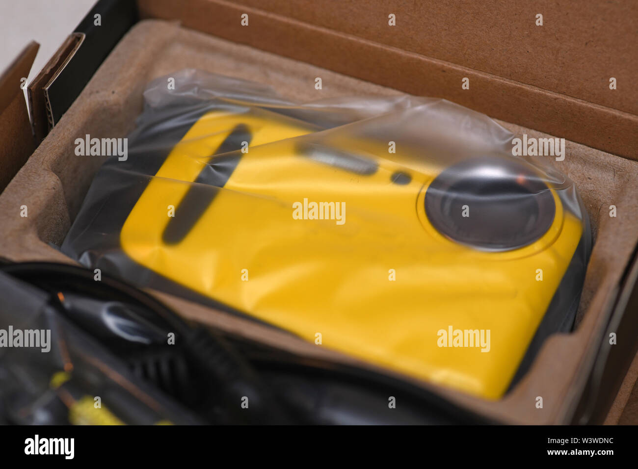 A new waterproof camera rests in its box with original packaging Stock Photo