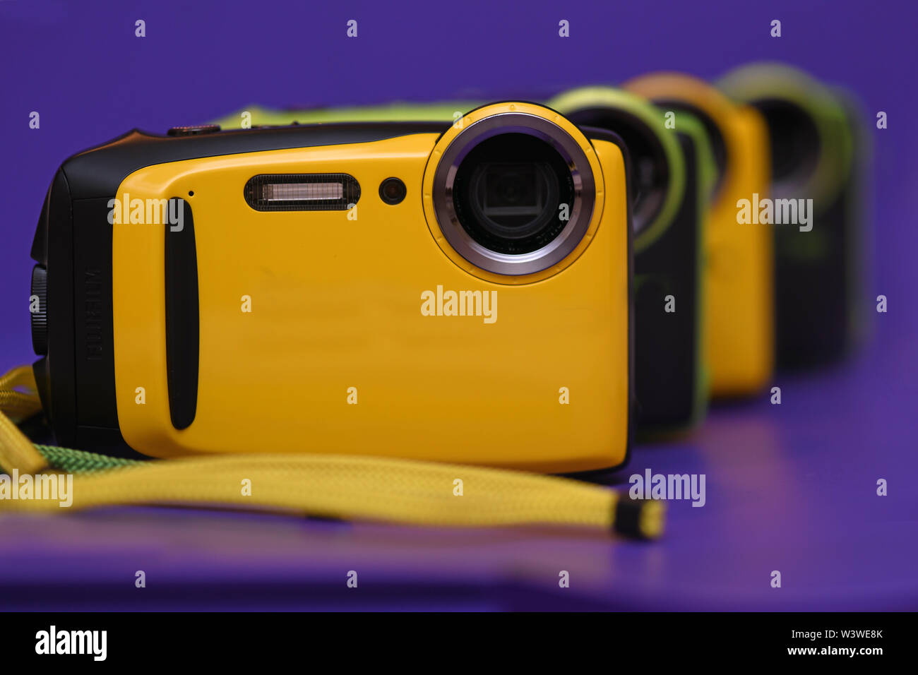 A lineup of new coplourful yellow and green waterproof cameras Stock Photo