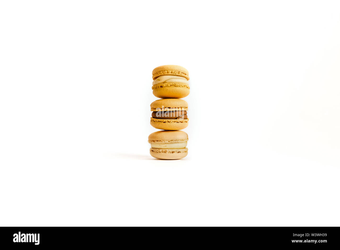 Three macaroons on an isolated background with space for your text. Stock Photo