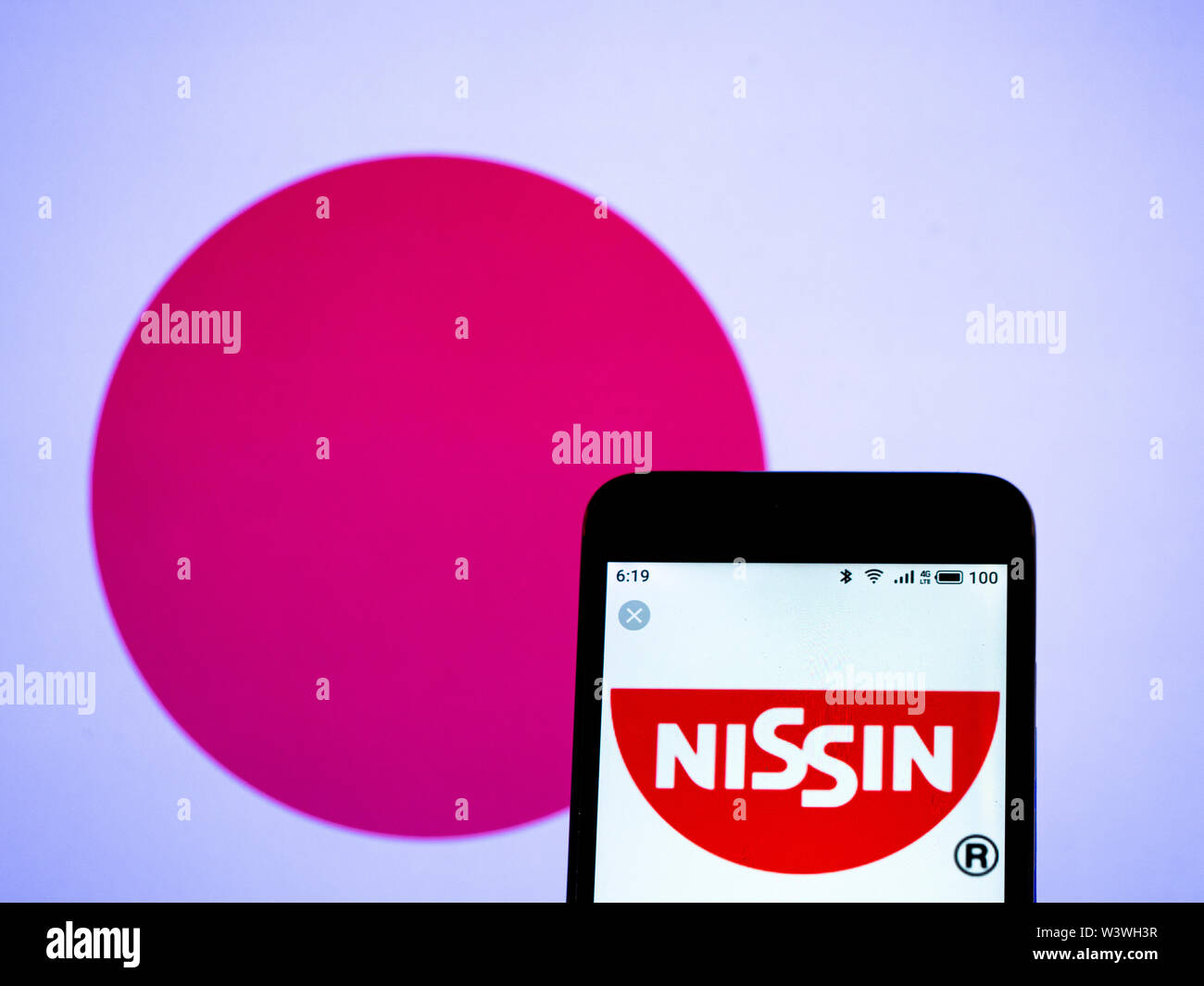 In this photo illustration the Nissin Food Products Co., Ltd. logo is seen displayed on a