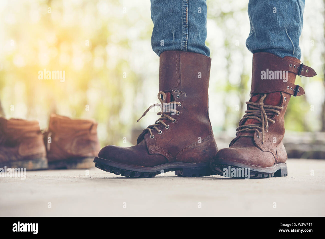 Man and brown boots and black jeans hi-res stock photography and images -  Alamy