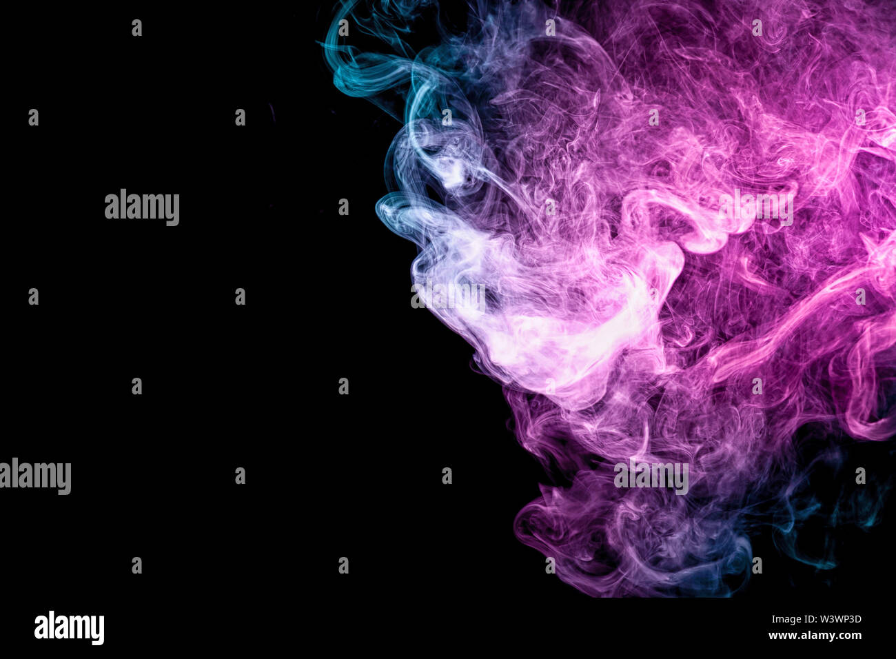 Blue and pink bomb smoke on black isolated background Stock Photo - Alamy