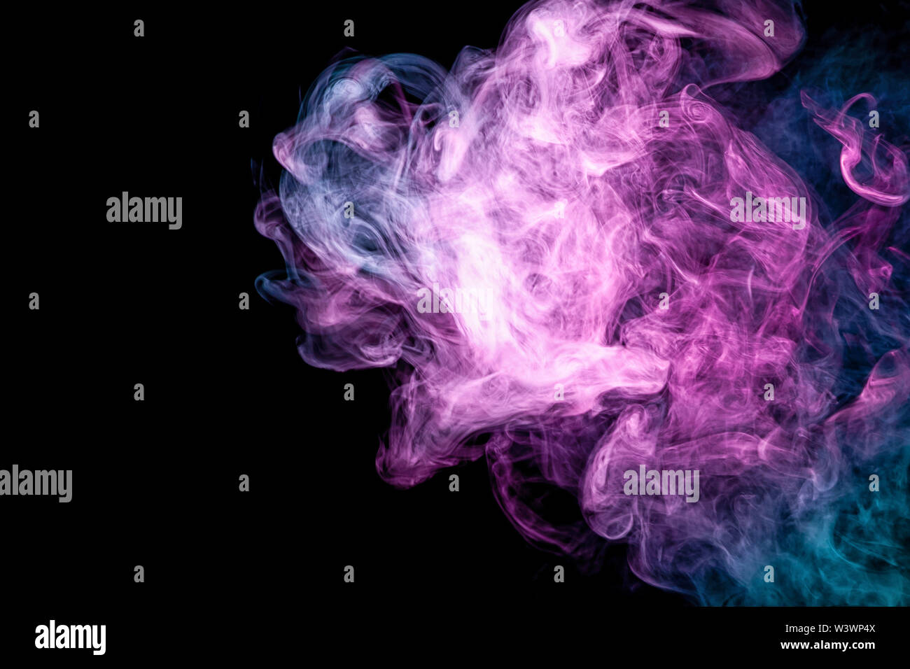 Blue and pink bomb smoke on black isolated background Stock Photo - Alamy