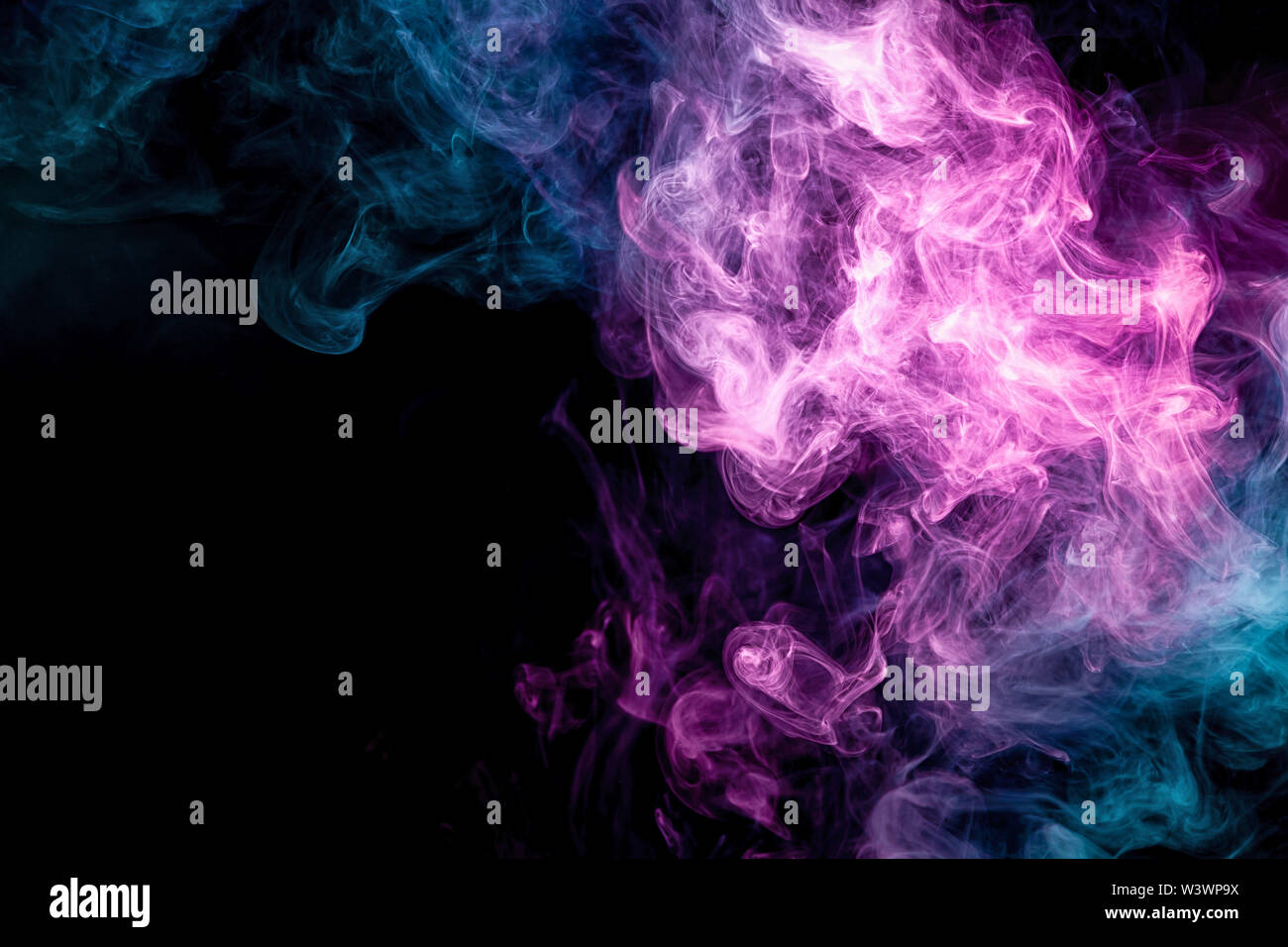 Cloud of pink and blue smoke on a black isolated background. Background ...