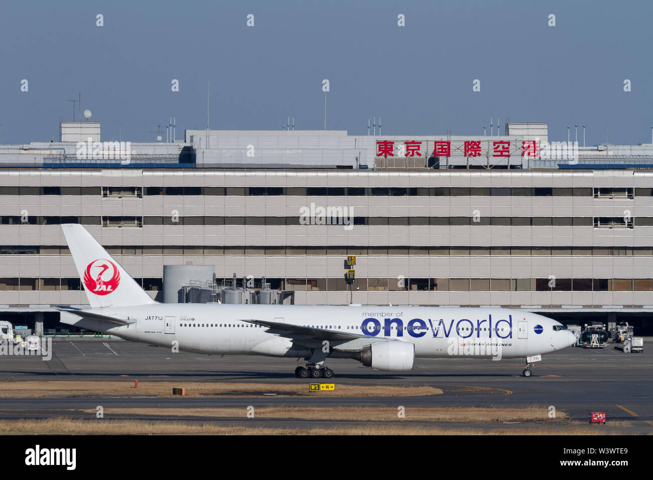 A Japan Airlines (JAL) Boeing 777-246 in One World livery at Haneda International Airport, Tokyo, Japan. Stock Photo