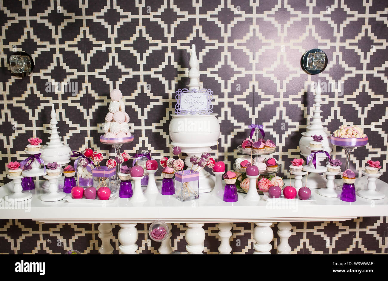 Candy bar. Table with sweets on the wedding day Stock Photo