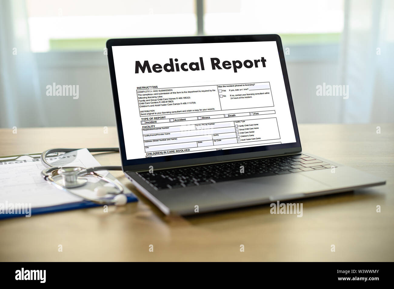 Doctor using computer medical record medical report or medical certificate database of patient's