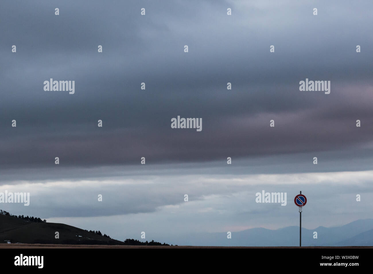 Road sign against a moody sky background with big clouds Stock Photo ...