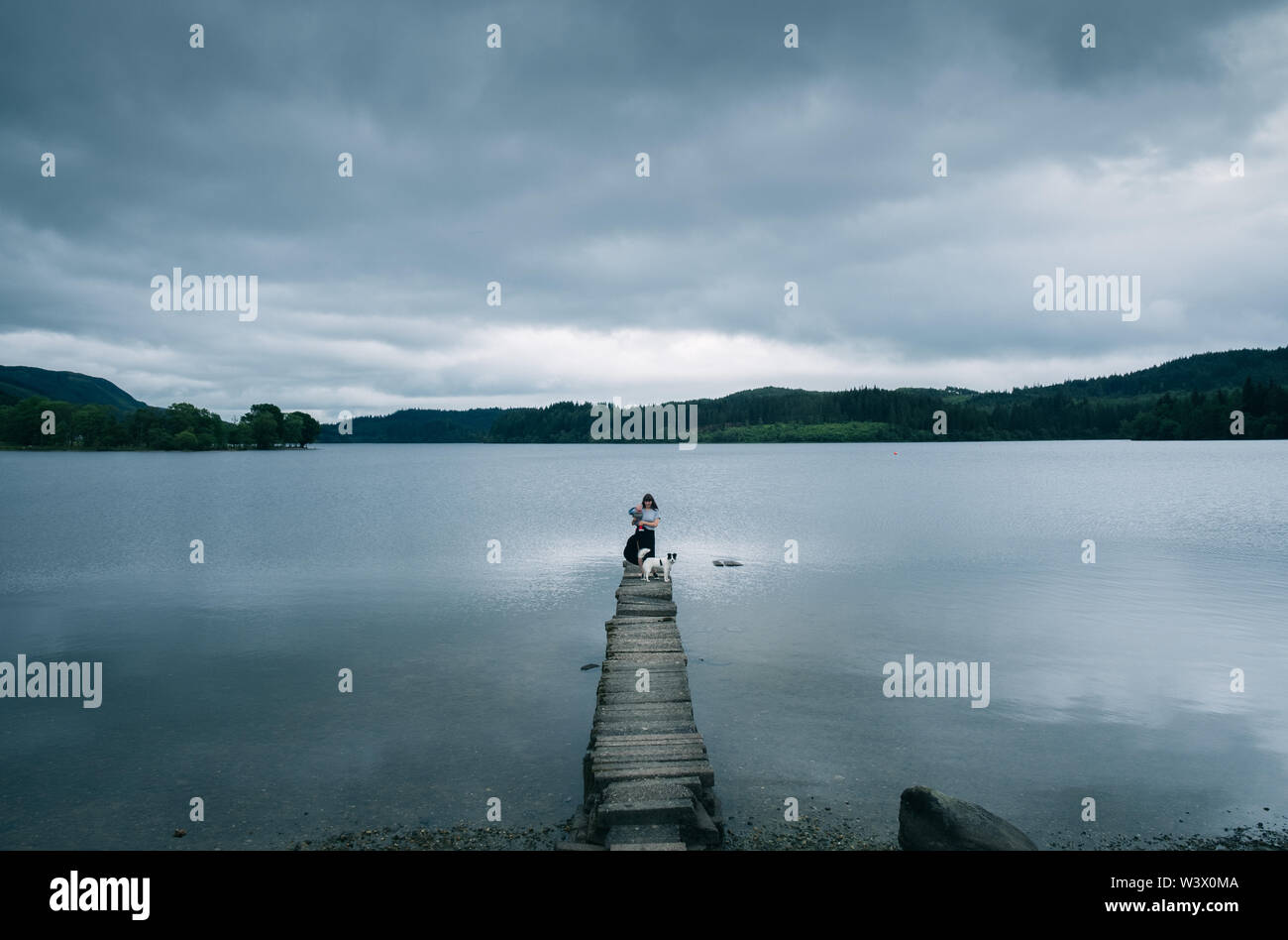 Kin Loch Ard Woman on jetty pier on Loch Ard , Kinlochard , Scotland Stock Photo - Alamy