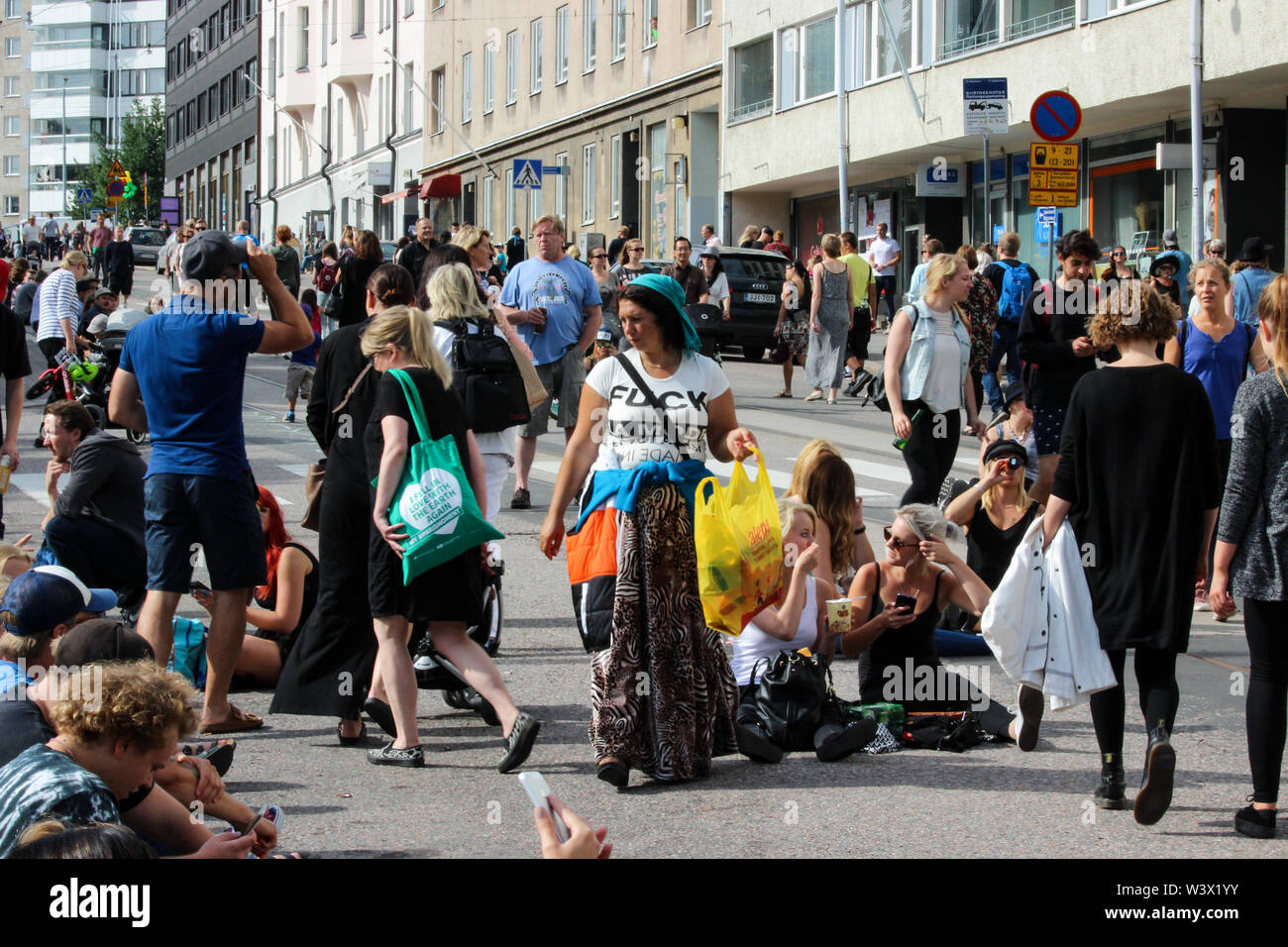 Romanian Romani woman collecting deposit bottles and cans during Kallio Block Party 2016 in Helsinki, Finland Stock Photo