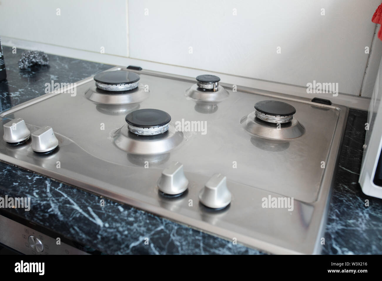 Polished gas cooker after washing.Perfectly clean gas cooker after