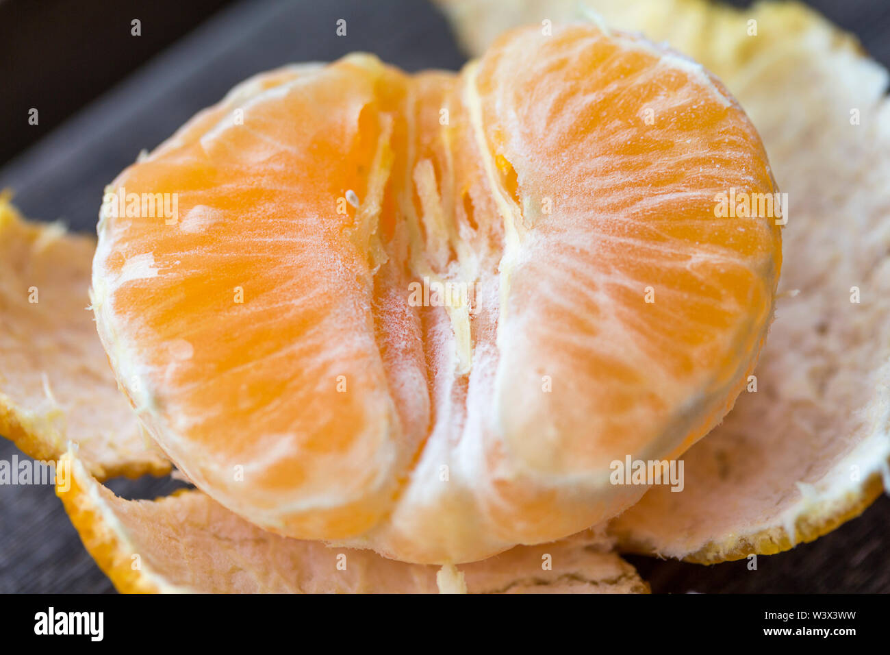Satsuma portion with peel removed hires stock photography and images