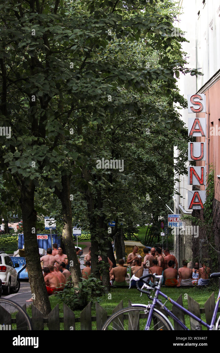 Men cooling off after sauna in front of public sauna in Helsinki, Finland Stock Photo