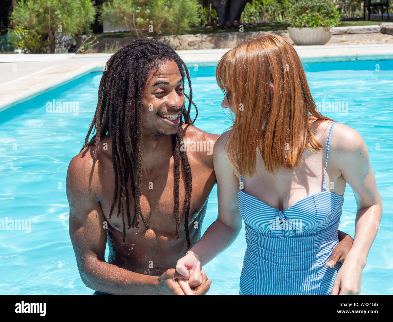 Amateur couple near a swimming pool