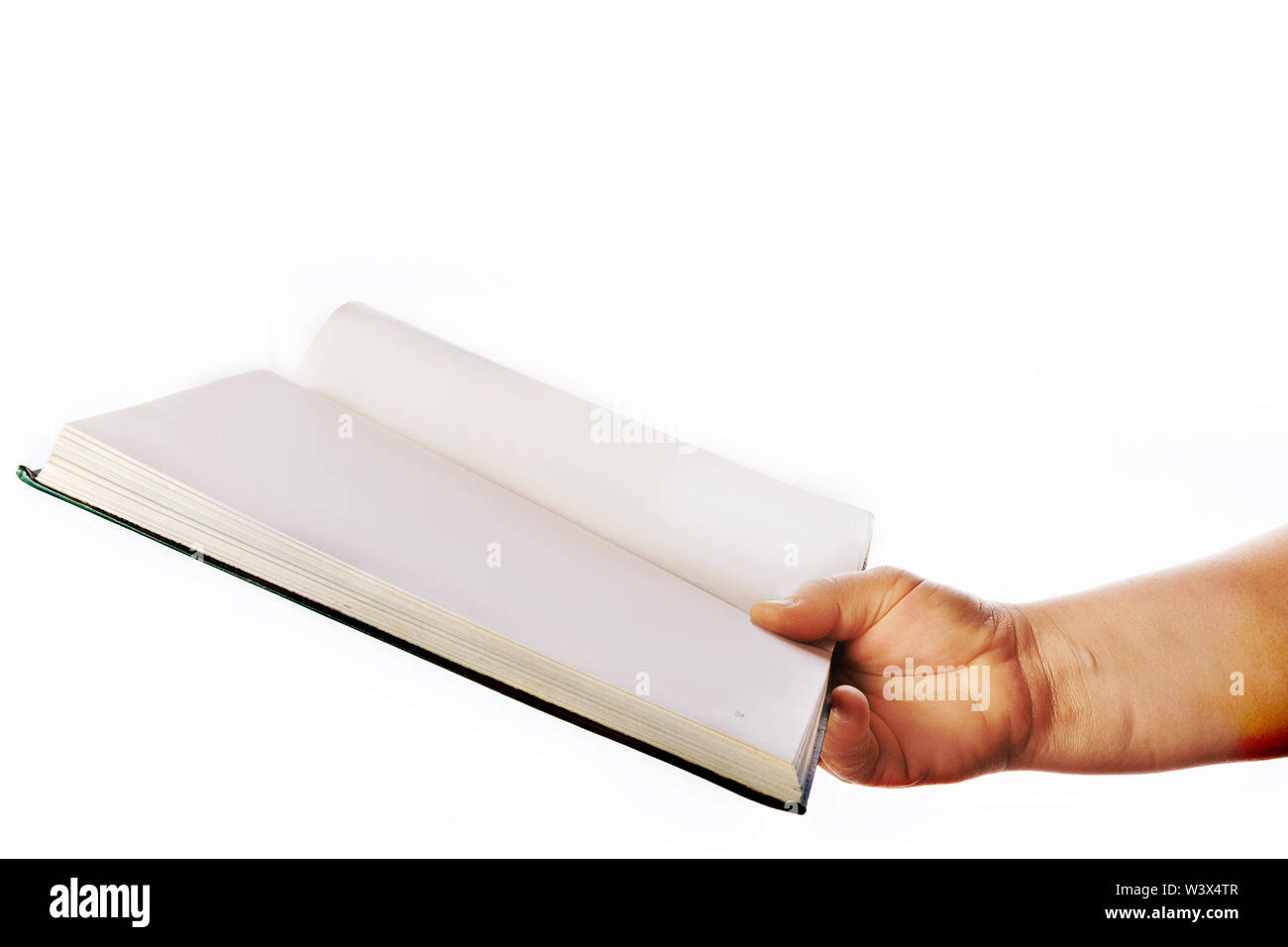 Woman's hand is holding a green book, on a white background. An open book for learning. Acquisition of knowledge. Academic education. Reading books. P Stock Photo