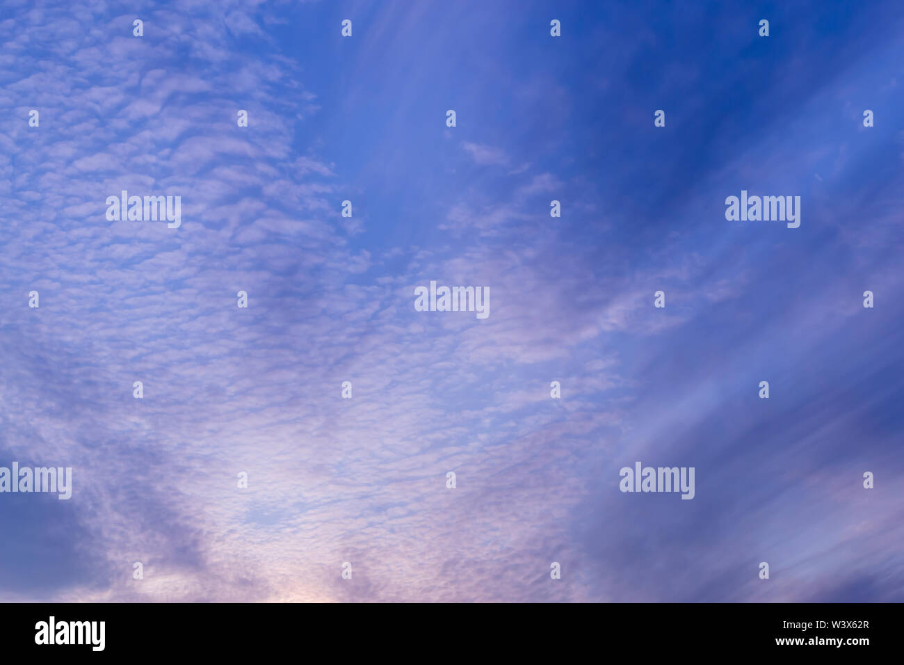 blue sky background with tiny clouds Stock Photo