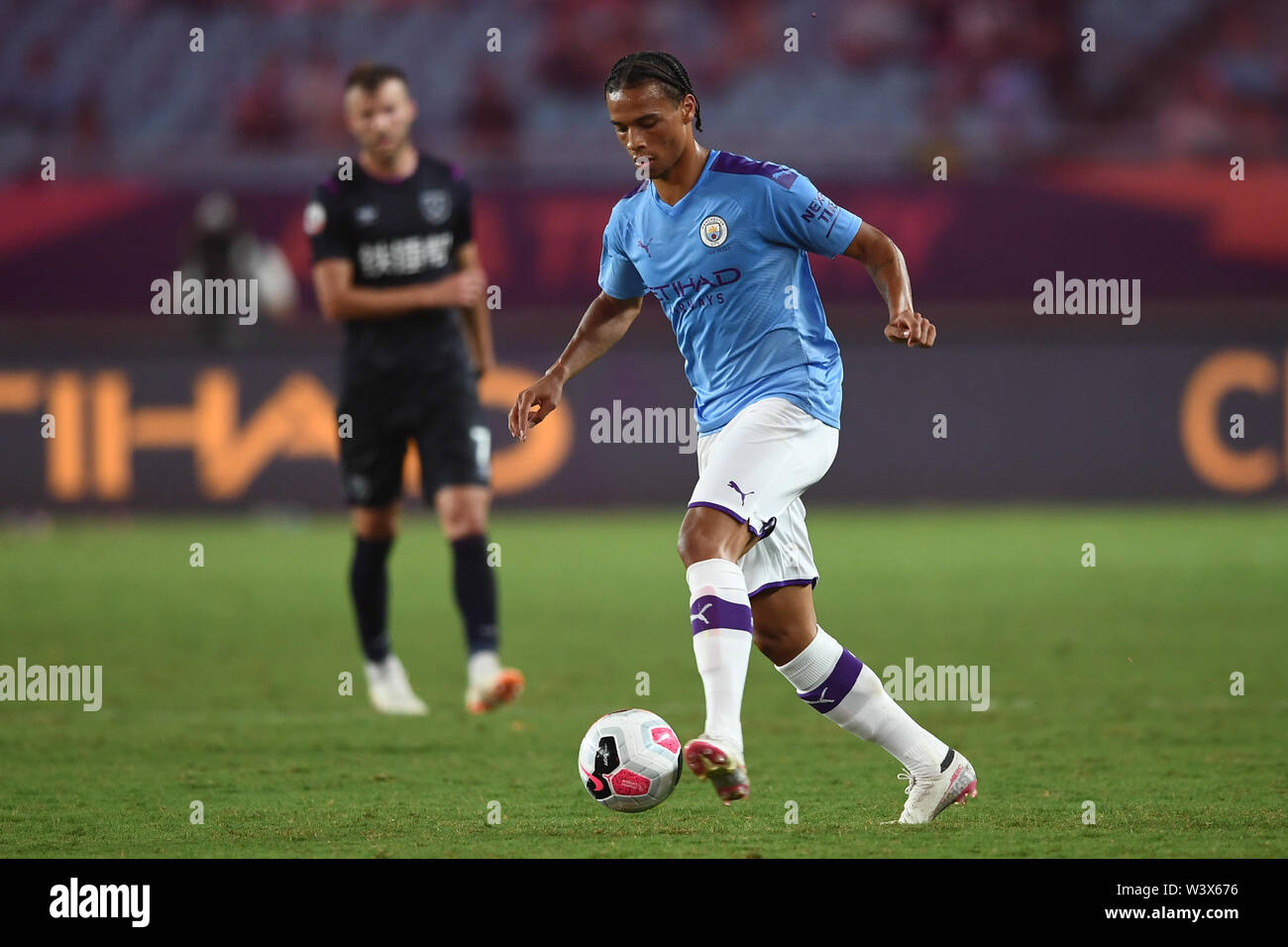 German football player Leroy Sane of Manchester City F.C. of English League champions dribbles against West Ham United F.C. in the semifinal match of the Premier League Asia Trophy 2019 in Nanjing city, east China's Jiangsu province, 17 July 2019. Manchester City F.C. defeated West Ham United F.C. 4-1. Stock Photo