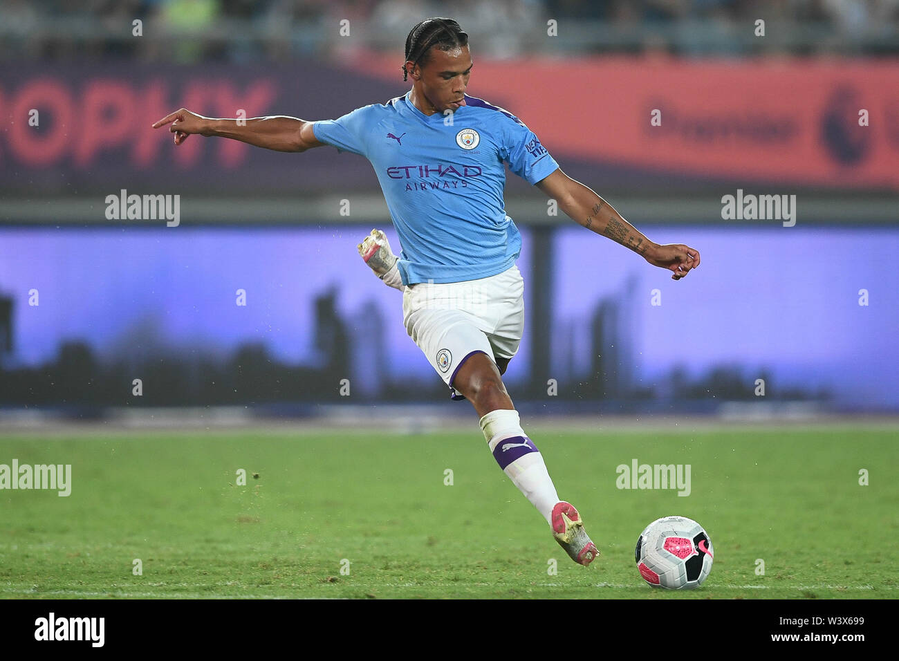 German football player Leroy Sane of Manchester City F.C. of English League champions dribbles against West Ham United F.C. in the semifinal match of the Premier League Asia Trophy 2019 in Nanjing city, east China's Jiangsu province, 17 July 2019. Manchester City F.C. defeated West Ham United F.C. 4-1. Stock Photo