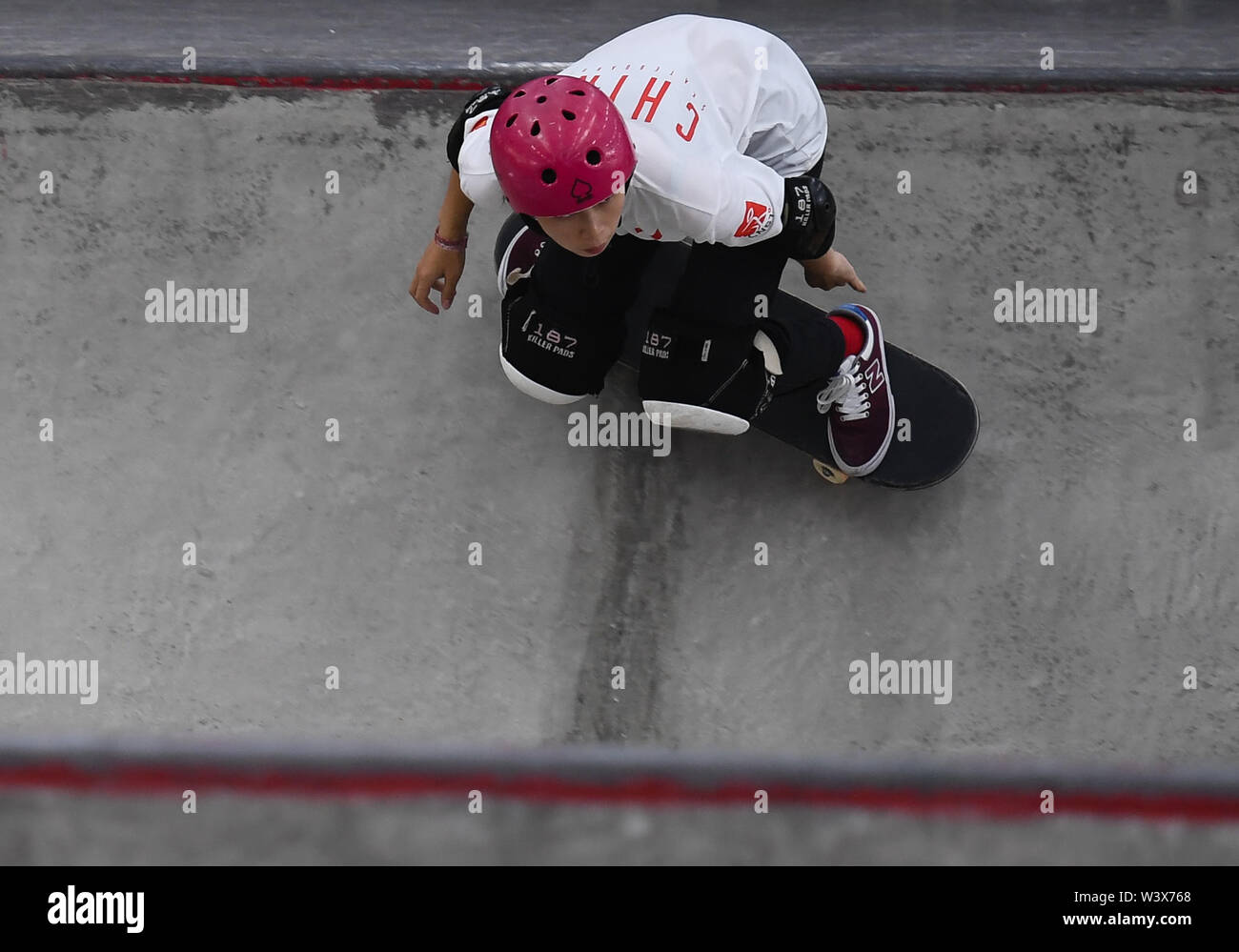 Nanjing. 18th July, 2019. Zhang Xin of China competes during the women quarterfinal at the 2019 International Skateboarding Open in Nanjing, east China's Jiangsu Province on July 18, 2019. Credit: Ji Chunpeng/Xinhua/Alamy Live News Stock Photo