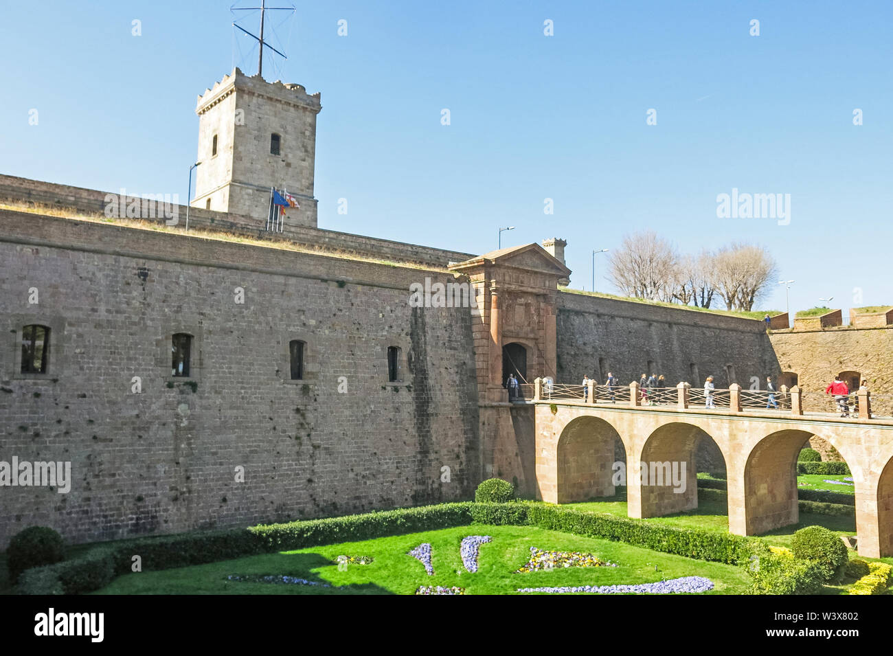 Barcelona, Spain - February 24, 2019: Tourists at the main entrance of the Montjuic Castle on the mountain of Montjuic, in the city of Barcelona. Spai Stock Photo