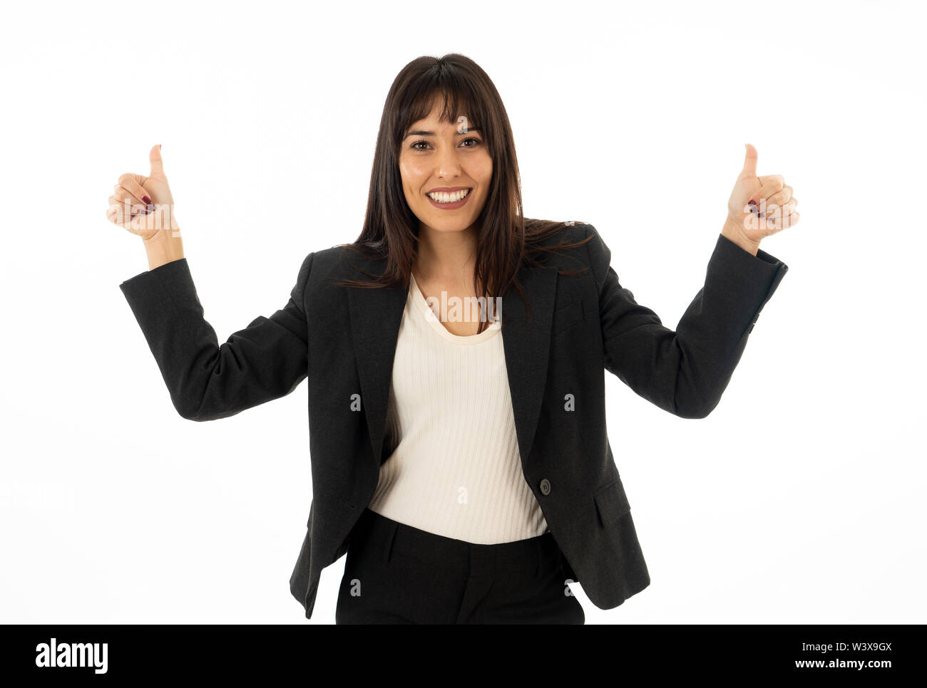 Close up of young pretty business woman standing and showing thumb up ...
