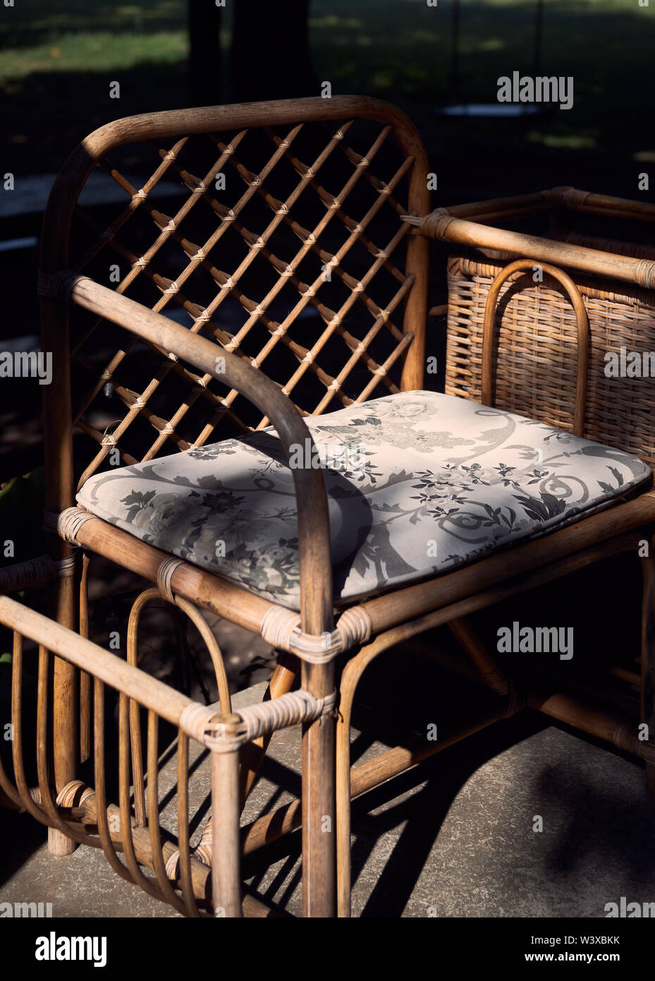 Old wicker arm chair Stock Photo - Alamy
