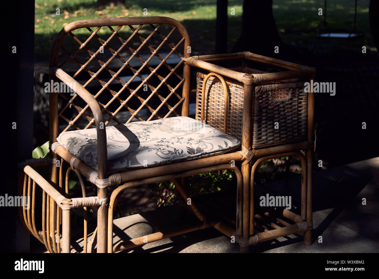 Old wicker arm chair Stock Photo - Alamy