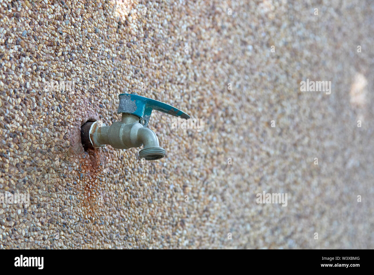 Faucet on wall Stock Photo Alamy