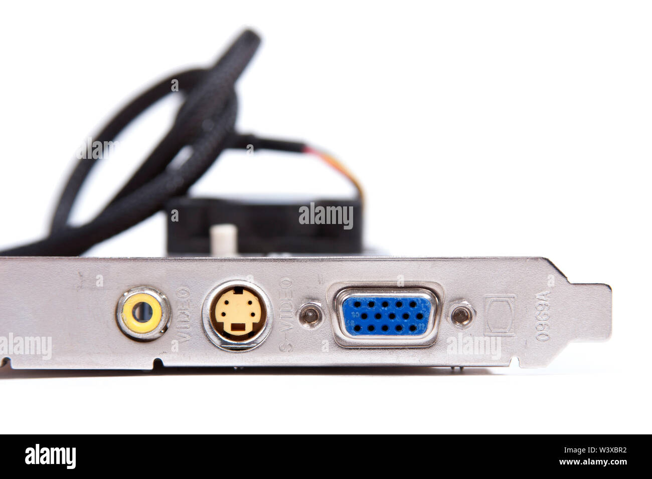 An old obsolete VGA / s-video output graphic card with archaic video outs isolated on white background. Low end pc gaming, old tech and pc components Stock Photo