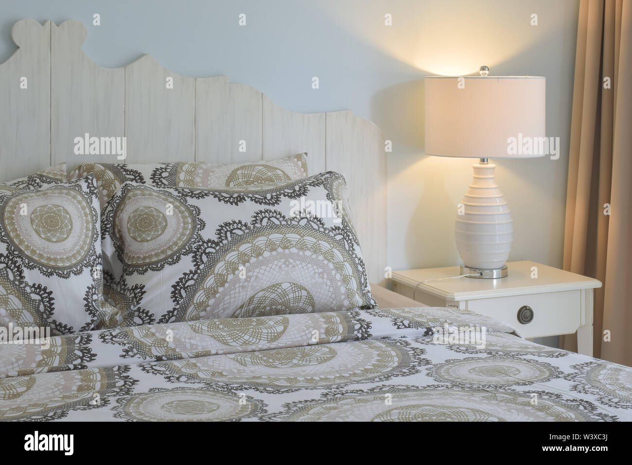 Retro Style Bedding With White Reading Lamp And Light Blue