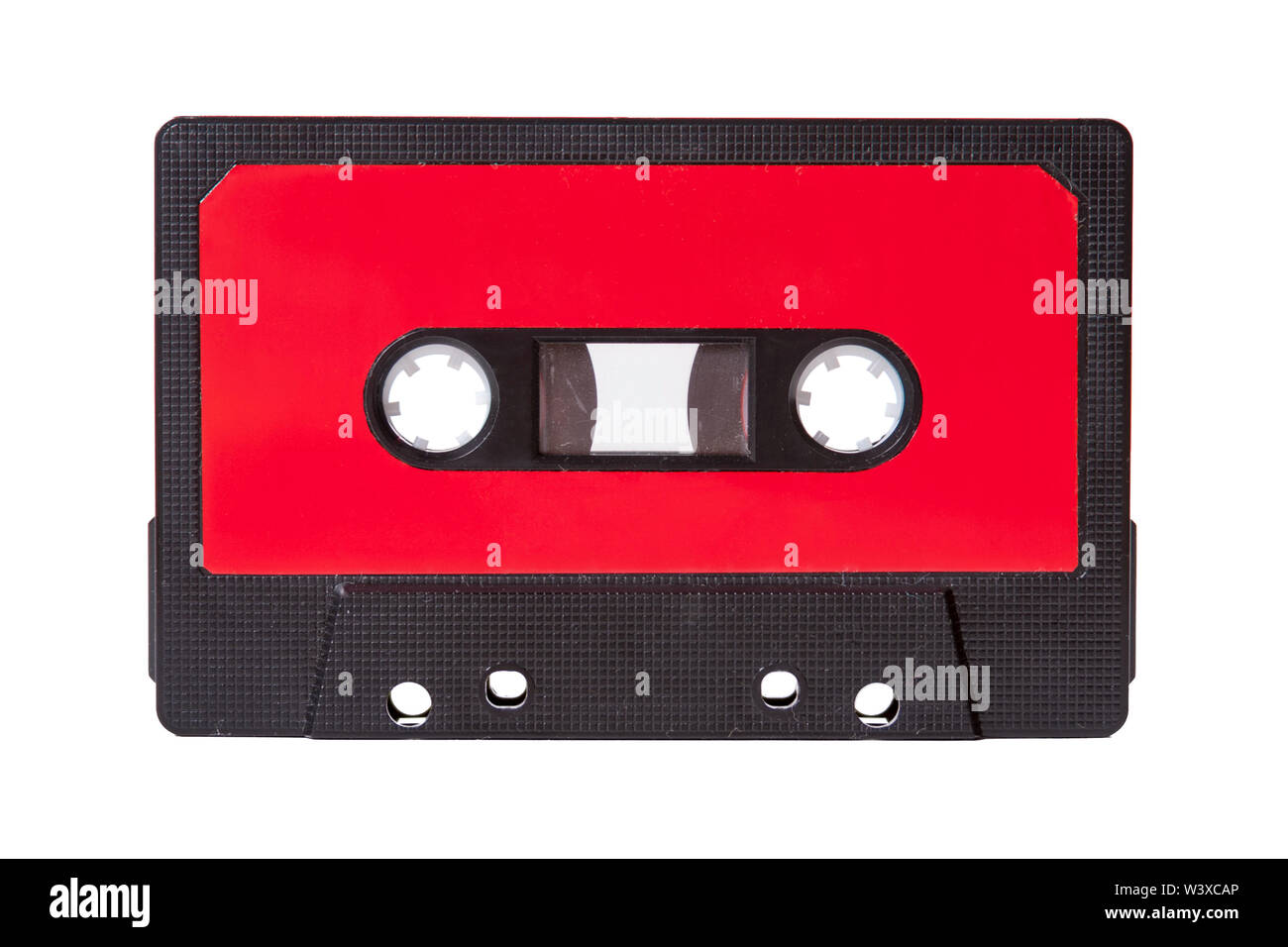 Blank red vintage cassette tape with an empty label isolated on white background, old retro audio equipment concept Stock Photo