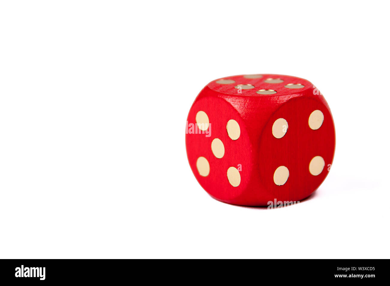 A big red dice isolated on white background with a six on top, gambling, dice games and first grade education and number learning concept Stock Photo