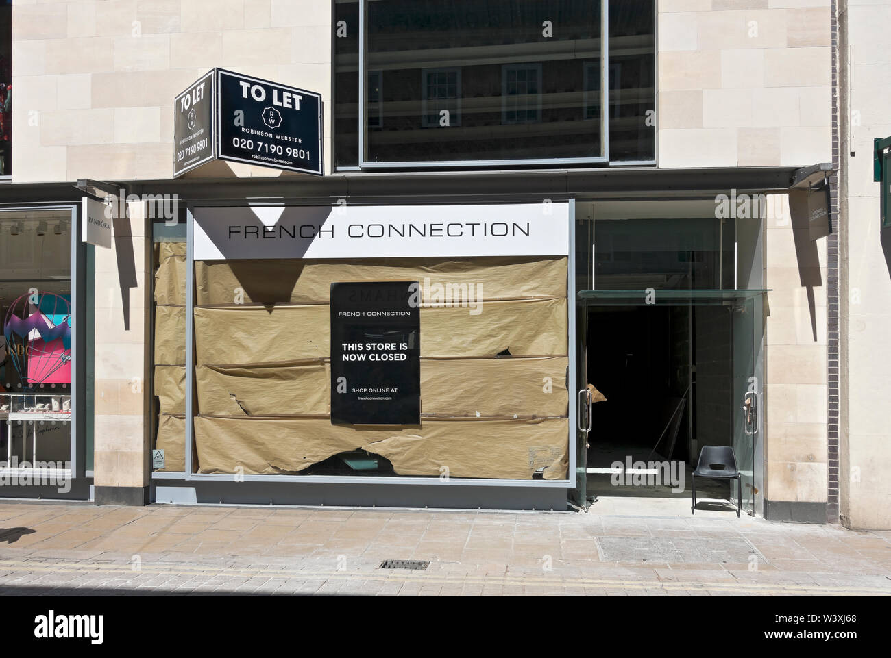 Closed high street French Connection empty shop store shops stores to let shopfront York North Yorkshire England UK United Kingdom GB Great Britain Stock Photo