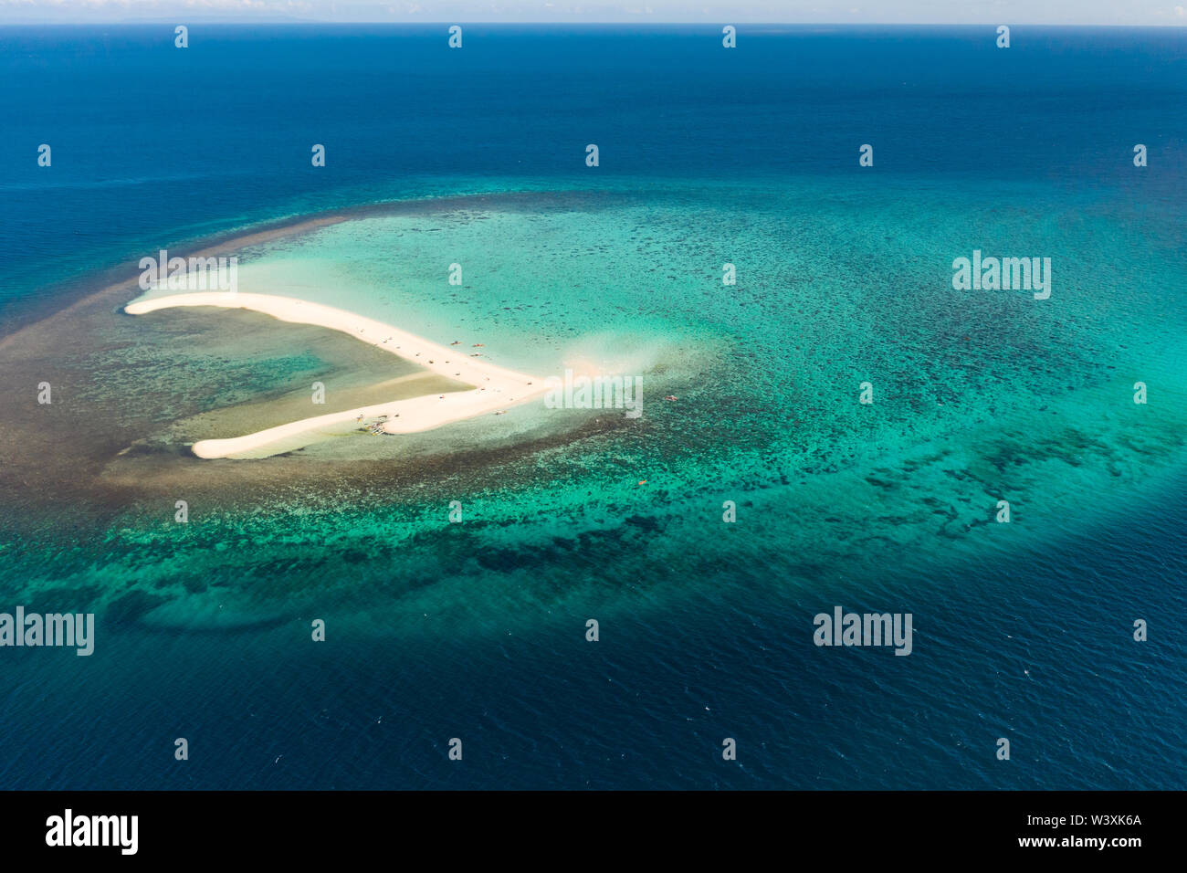 White sandy island with coral reefs.White sandbar.Atoll near the island of Camiguin, Philippines, aerial view.Seascape, white sand island Stock Photo