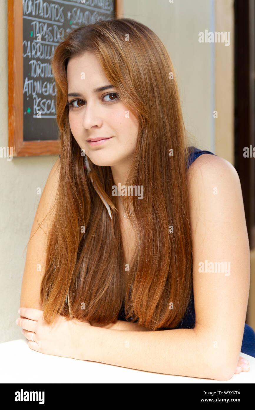 young actress posing with the lighting of the 80s outdoors Stock Photo