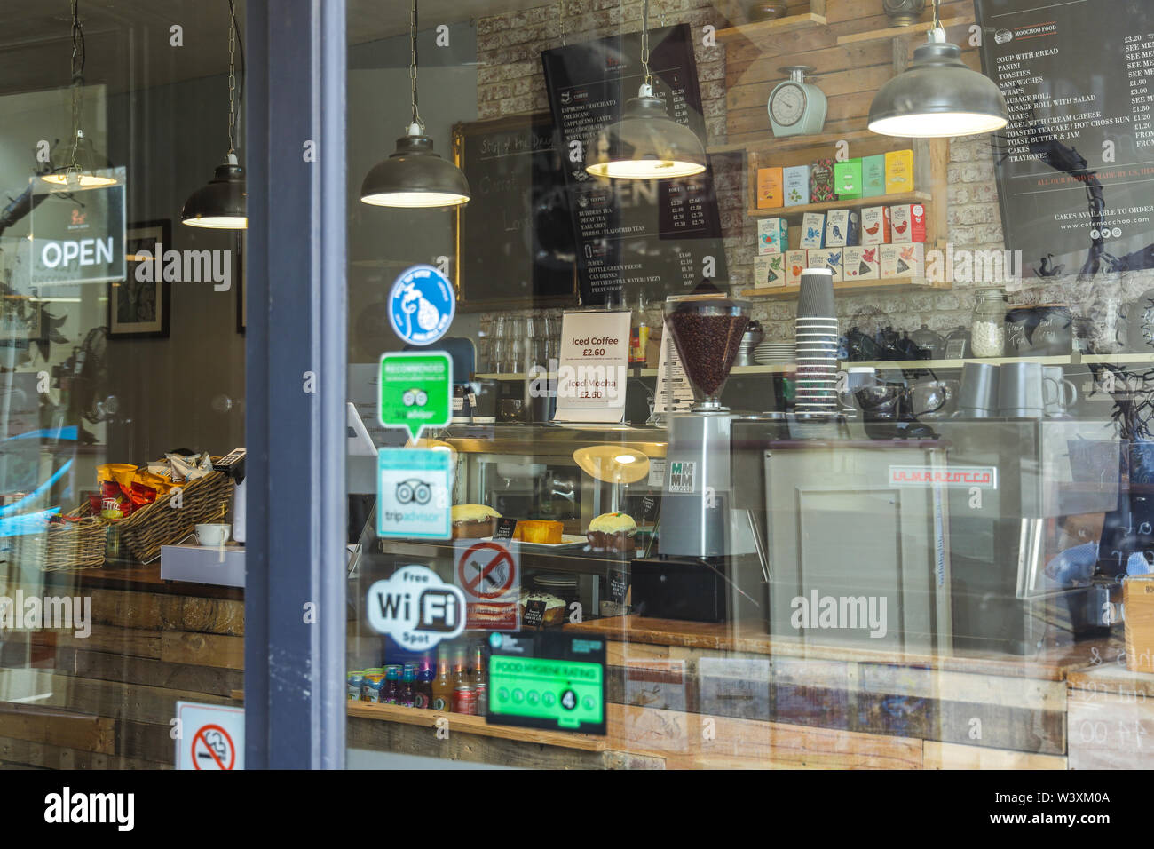 Looking into a trendy coffee shop through the window Stock Photo
