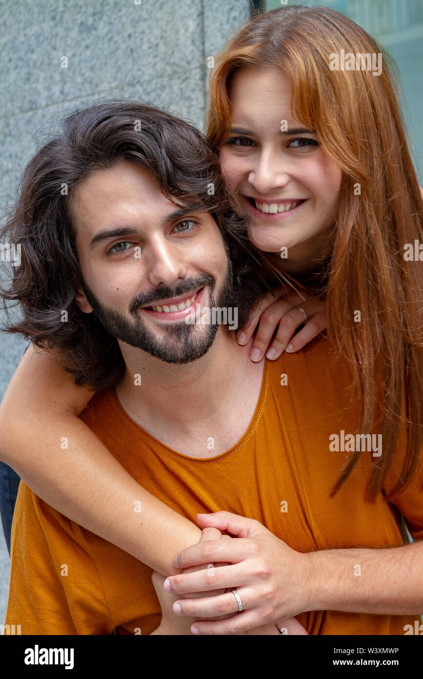 Portraits of a couple Young, complicit and smiling around the city Stock Photo
