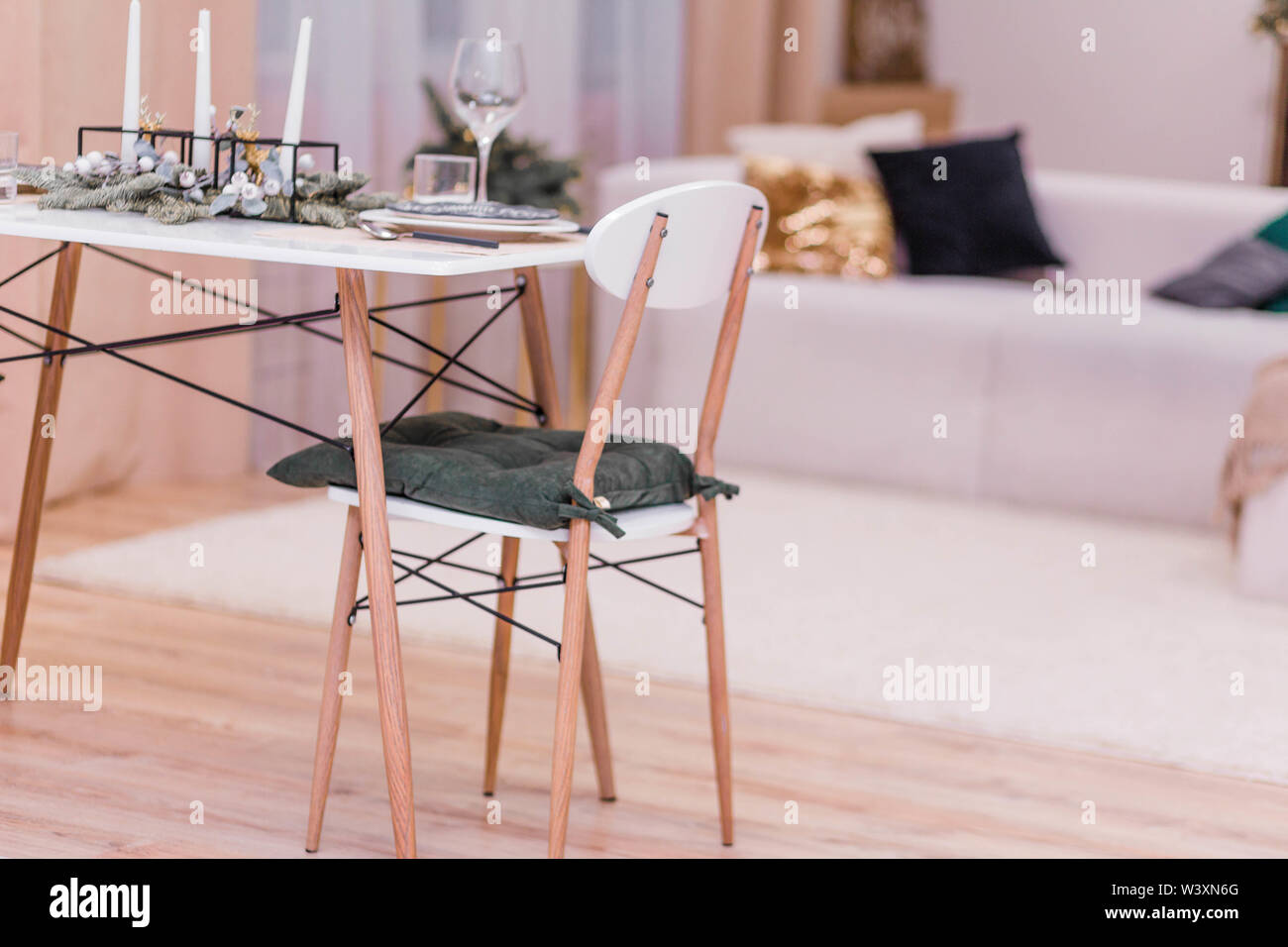 Table setting in the New Year's style. Simple and stylish interior rooms in the New Year's style Stock Photo