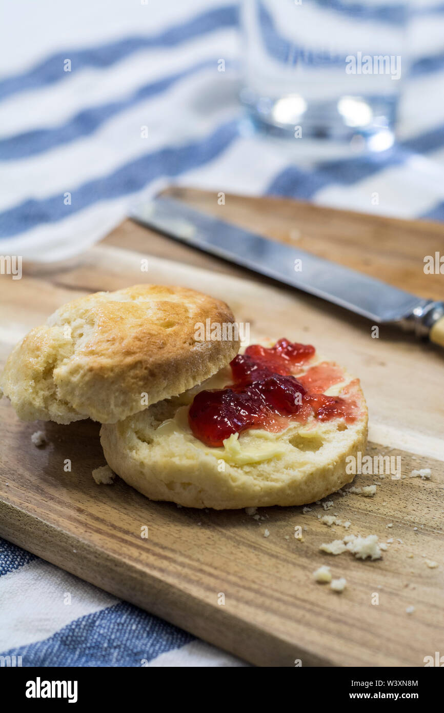 Homemade scone with jam and butter Stock Photo Alamy