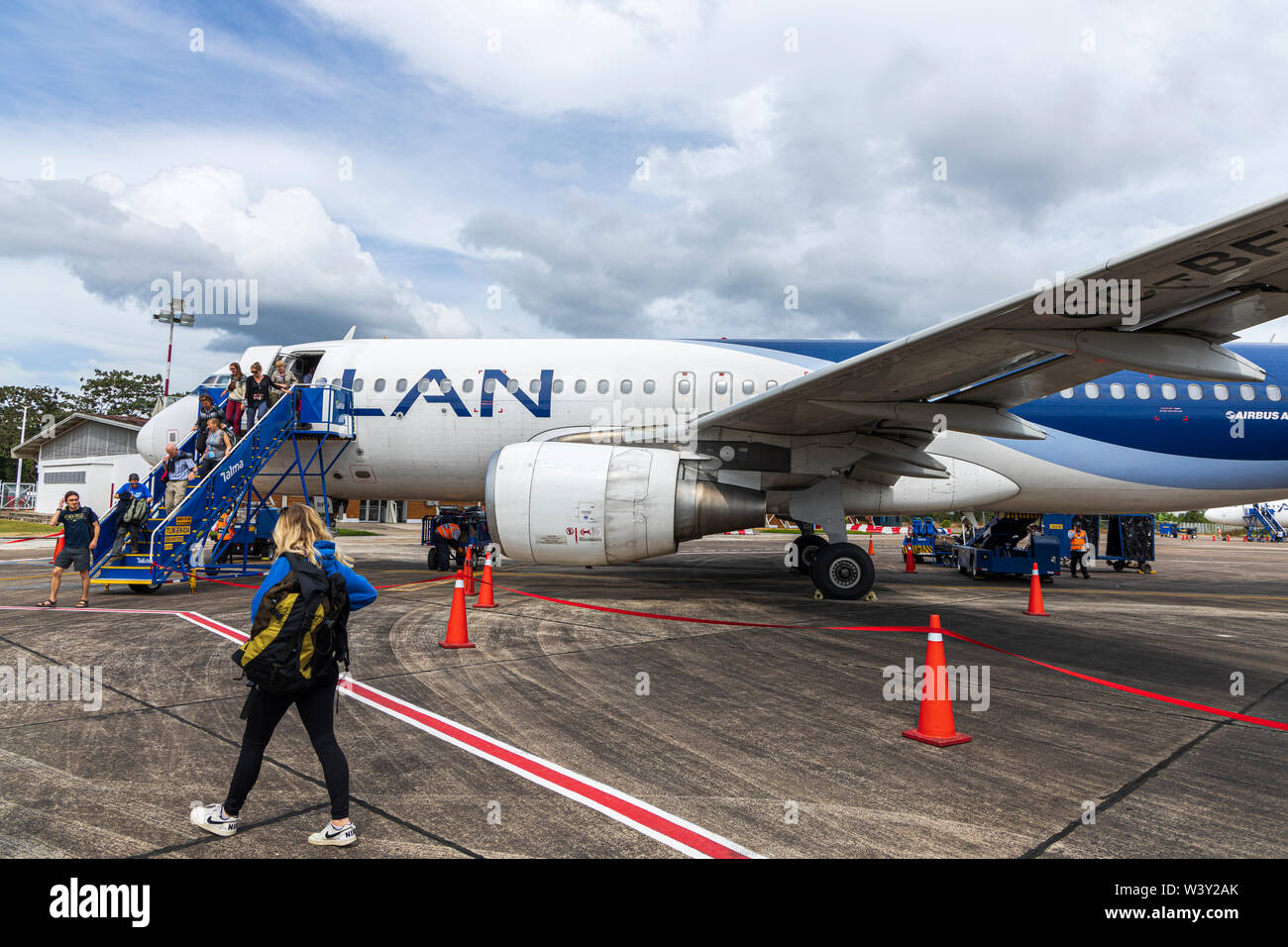 Disembarking from an Airbus A320 plane, and arriving to the terminal building at Aeropuerto Internacional Padre Aldamiz, Puerto Maldonado,  Peru, Sout Stock Photo