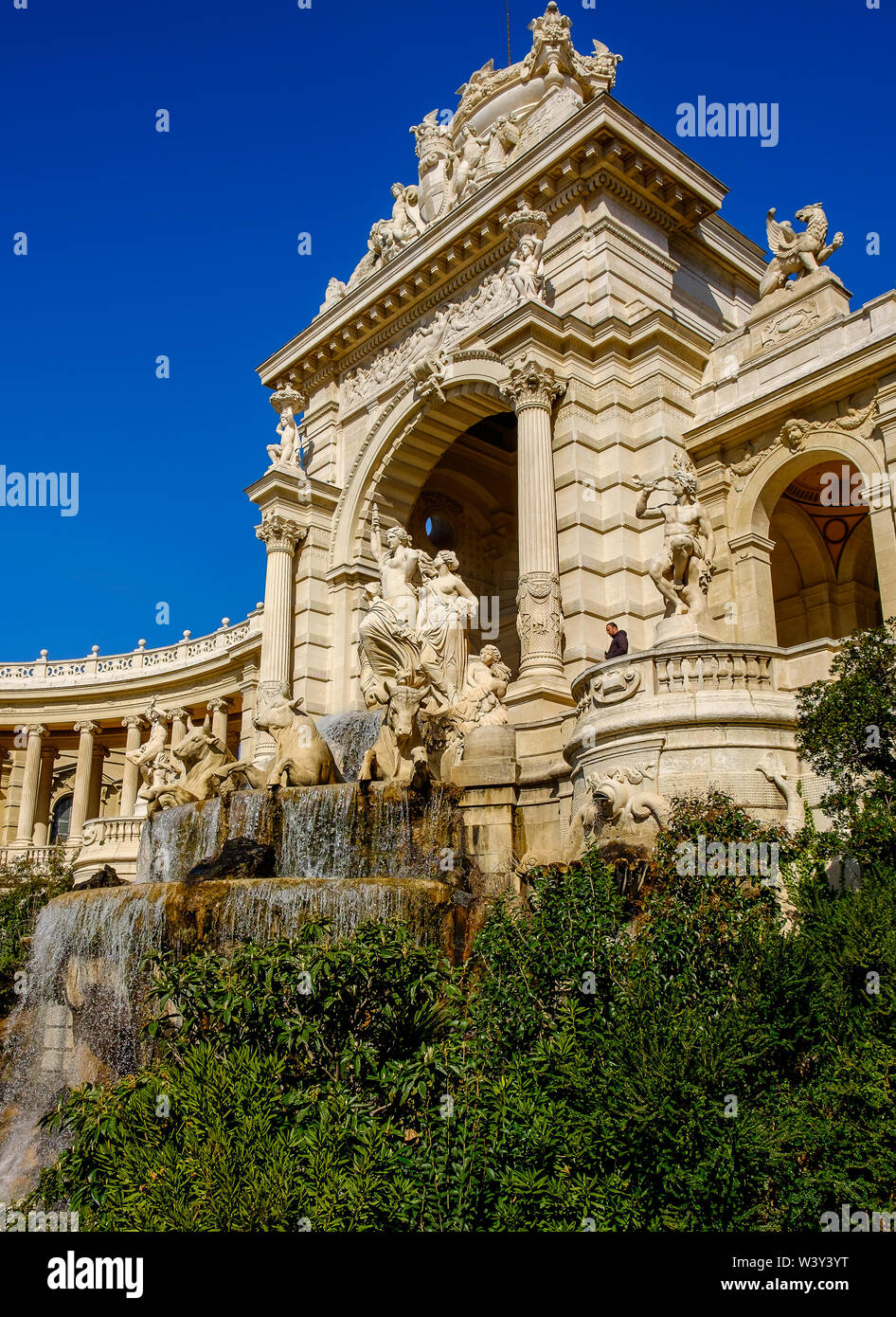 Marseilles, France, March 2019, fountain known as “water castle” and sculptures of four large bulls and three women in the  Palais Longchamp. Stock Photo