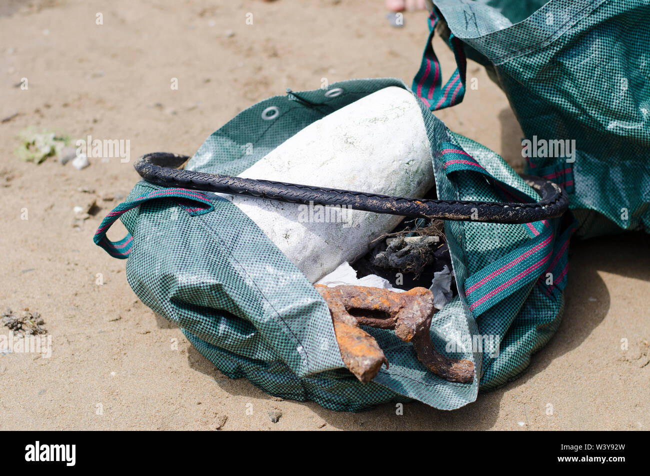 Trash Collected in Sturdy Bag During Beach Clean Stock Photo Alamy