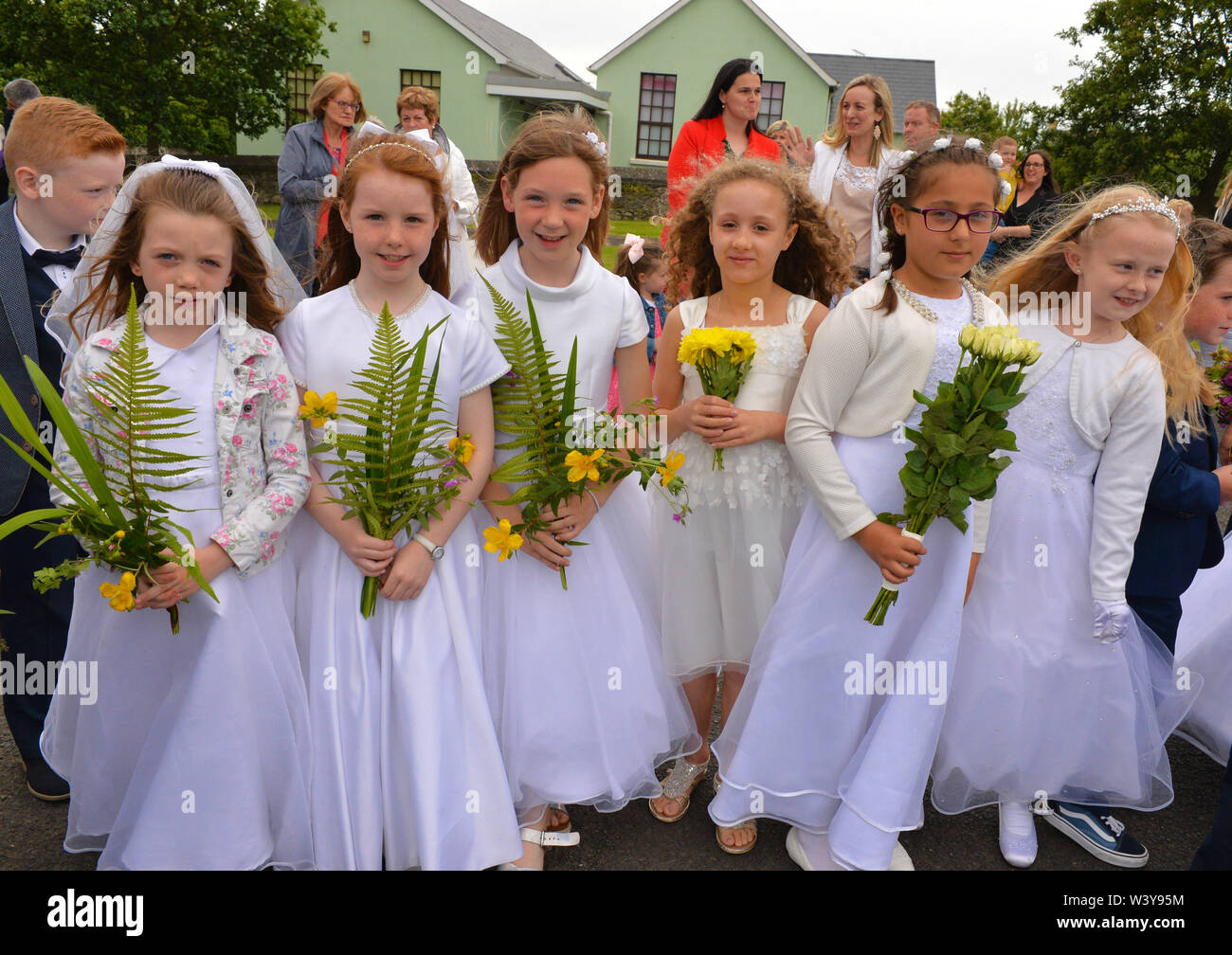 Catholic children in the First Holy Communion dresses take part in
