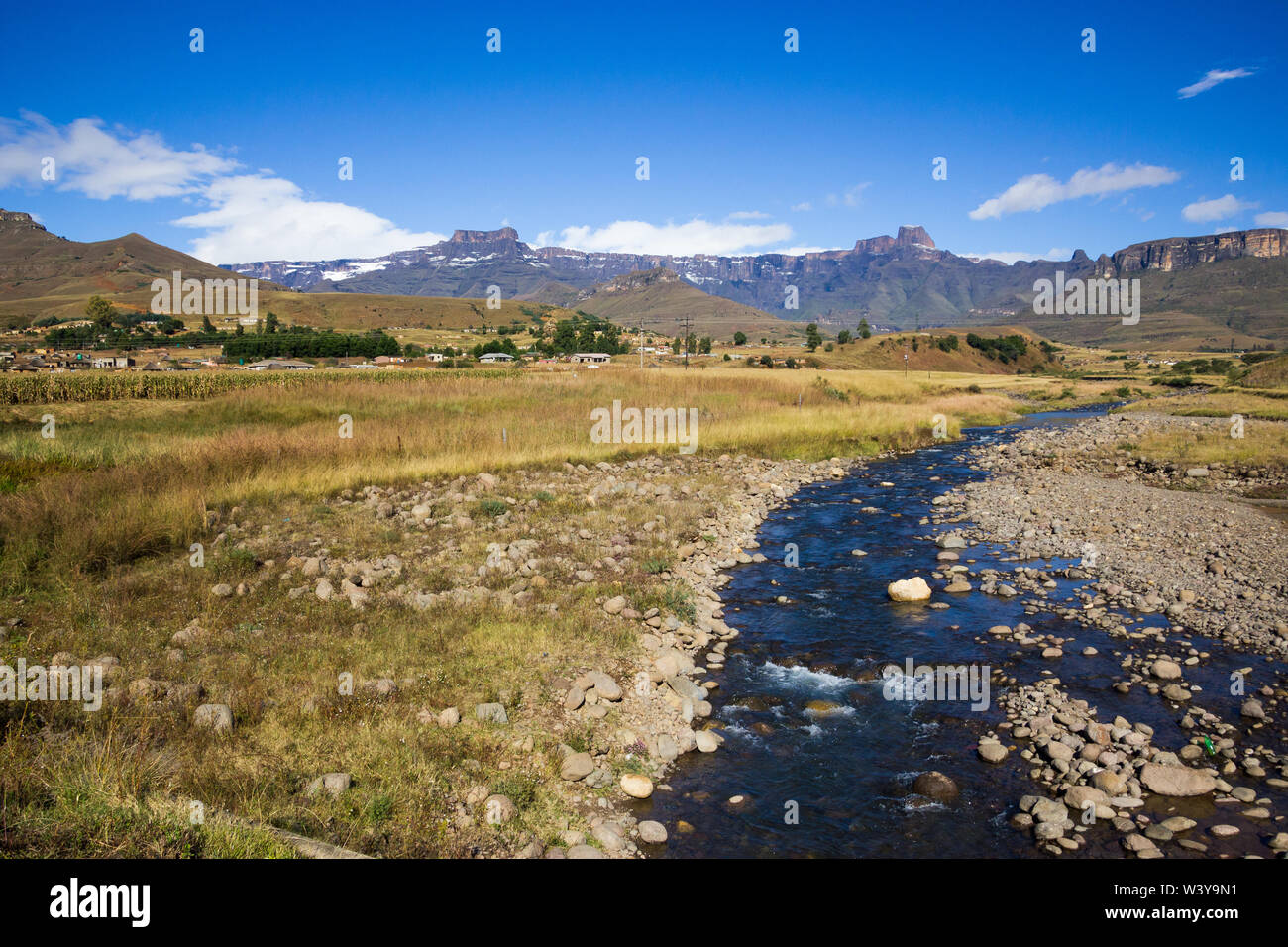 African landscape and scenic panoramic view onto the Drakensberg mountains and snow covered Amphitheatre region Kwazulu Natal, South Africa in Winter Stock Photo