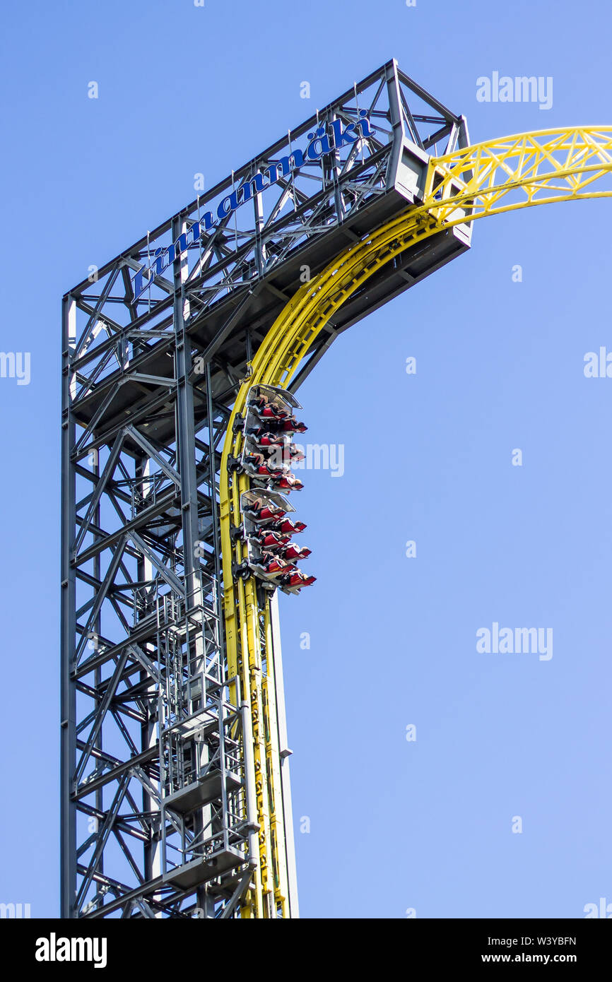 Helsinki, Finland - June 23. 2019 - People rising straight up in the Linnanmaki Amusement Parks roller coaster Ukko Stock Photo