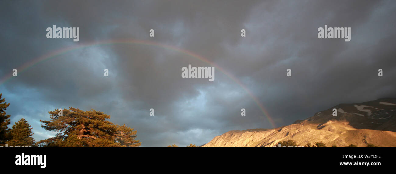 cloudy sky and rainbow after rain Stock Photo - Alamy