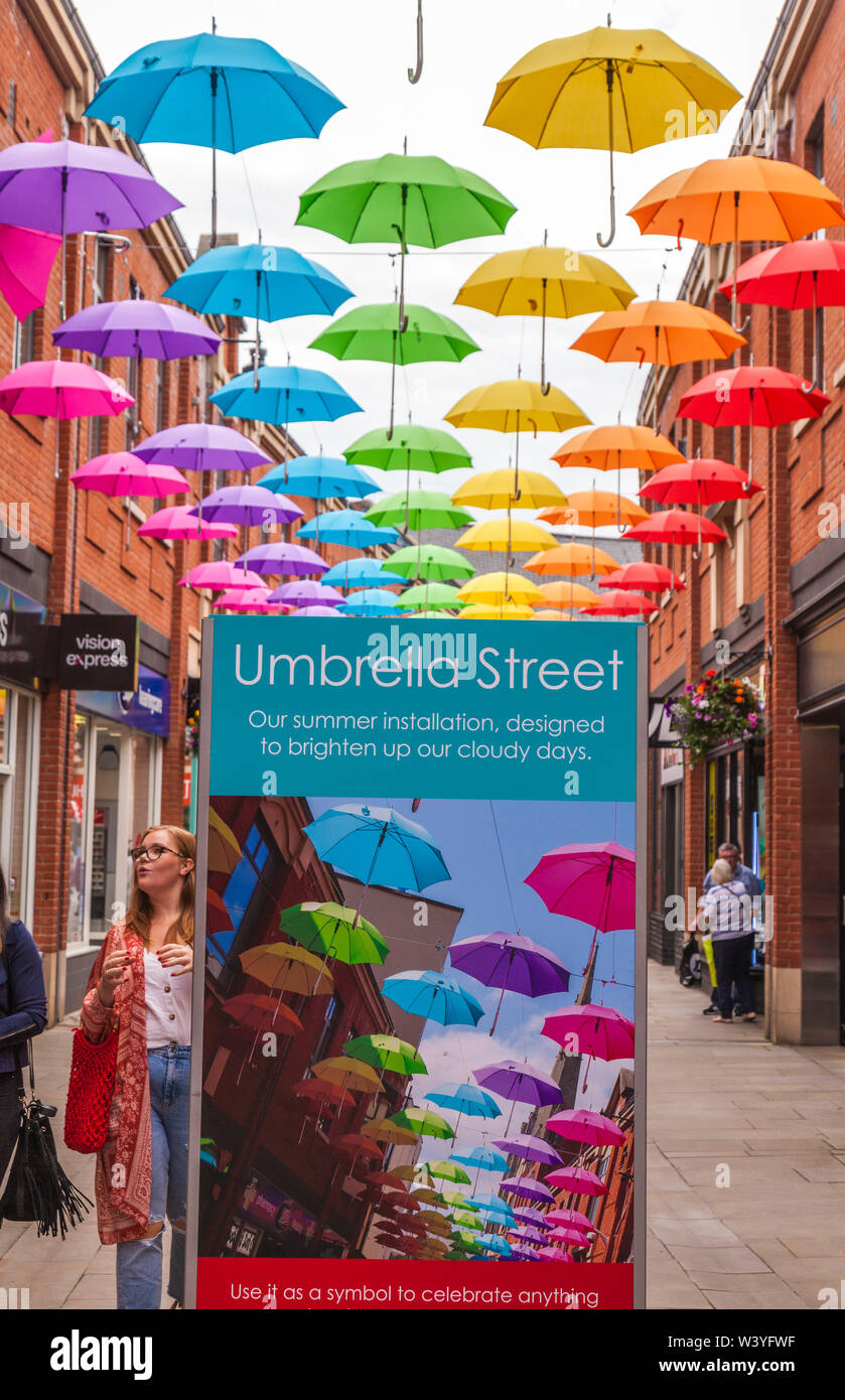 A colourful display of umbrellas hanging overhead in the shopping precinct in Durham,England,UK